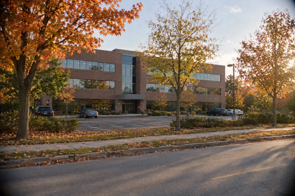 Suburban office building on a tree-lined boulevard in autumn